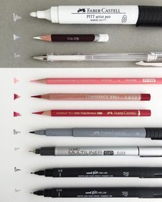 several different pens lined up next to each other