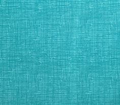 a close up view of the fabric in turquoise blue, which is very soft and plain