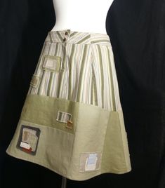 This khacki, olive, and creme skirt is durable, made from a soft jean-like material on the top with medium weight linen and cotton pieces added below. There are snaps and zipper in the front for easily slipping on. Intended to comfortably sit on the hips, but can also be worn as a waist skirt for slightly bigger sizes.  Style: Broomstick, A-line Size: Small-Medium. Waist 26-30 depending on if you wear it on your high waist or closer to hips.  Hips 30-36. Length from waist to hem: 20.5". Material Upcycled Skirt, 60’s Style, 60's Style, Patchwork Skirt, Repurposed Vintage, 60s Fashion, Womens Skirts, Upcycled Vintage, Vintage Fabrics