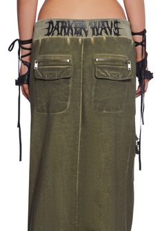 in a French terry cloth construction with a washed finish. With a ribbed waistline, a waistband with adjustable tie closures, side pockets, 1 front zippered cargo pocket with 2 pockets with velcro closures, 1 front pocket with velcro closure and zippered detail, 2 back pockets with velcro closures and zippered details, a distressed raw hem, and Darker Wavs printed logo on the back. Maxi Cargo Skirt, Punk Pants, Dark In Love, Pride Outfit, Cargo Skirt, Cargo Pocket, Trendy Clothes For Women, Green Skirt, Bottom Clothes