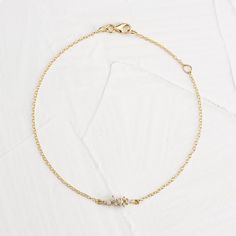 Our sparkling Olivia bracelet features nine natural VS quality round brilliant cut diamonds prong set in 14K Solid Gold along with a sturdy 1.3mm cable chain and lobster clasp for additional security. The largest are 2mm diamonds and the smallest being 1mm diamonds. This feminine bracelet is available in 14K Solid Yellow and White Gold. ✨ Features ✨ • Ships Next Day / Fedex 2 Day Service• Made in the USA.• Gold : Solid 14K• Choice of Gold: Yellow Gold, White Gold• Diamond Cut: Round• Total Diamo Yellow Gold Diamond Bracelet With Cable Chain As Gift, Diamond Bracelet With Delicate Chain, Dainty Single Cut Diamond Bracelet, Dainty Diamond Chain Bracelet With Single Cut Diamonds, Yellow Gold Bracelets With Cable Chain, Minimalist Gold Diamond Bracelet With Accents, Diamond Cable Chain Bracelet In Yellow Gold, Yellow Gold Diamond Bracelet With Cable Chain, Adjustable 14k Gold Delicate Diamond Bracelet