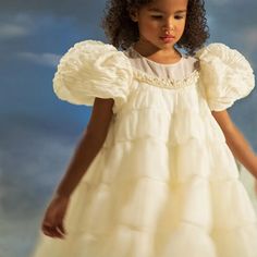 Indulge your little princess with the luxurious DreamyVow White Flower Girl Dress. Adorned with delicate beading and pearls, this dress is fit for royalty. Perfect for weddings, birthdays, and first communions, it will make your child feel like the belle of the ball. Order now for a truly enchanted experience. White Jumpsuit Wedding, White Flower Girl Dress, Yellow Evening Dresses, Grey Evening Dresses, Champagne Evening Dress, Boho Wedding Gowns, Gold Evening Dresses, Beach Bridal Gown, Bridal Jumpsuit