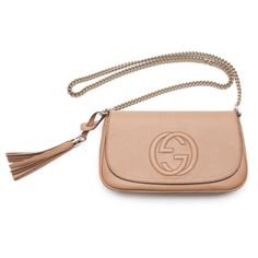 This beautiful embossed camelia beige crossbody is the perfect bag for any everyday look or dressed up for a night out. The color makes it easy to match everything in your wardrobe and the classic embossed Gucci logo makes it a complete classic piece for any handbag collection. The detachable leather tassel is a perfect fun touch to this bag. Though lightweight and its small appearance, this bag is large enough to easily carry all of your essentials.    Model: 536224  Beige Textured Calf Leather   Gold-Tone Hardware  Gucci GG Embossed Logo  Detachable Tassel Accent  Gold Chain Strap  Front Flap Magnetic Snap Closure  Tan Canvas Interior lining  One Interior Zip pocket  One Interior  Slip pocket  Strap Drop: 21.5" inches  Measurements: 11" x 3.5" x 6.75" (LWH)  Includes controllato cards an Chic Gucci Crossbody Shoulder Bag, Gucci Beige Crossbody Bag, Chic Gucci Shoulder Bag In Beige, Chic Beige Gucci Shoulder Bag, Chic Gucci Clutch Bag, Chic Gucci Leather Clutch, Gucci Chic Evening Clutch, Elegant Gucci Leather Clutch, Chic Gucci Clutch For Evening