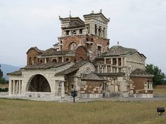 an old building in the middle of a field