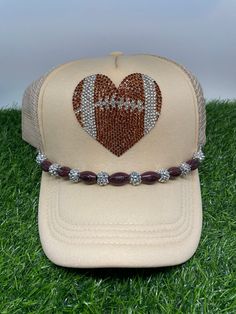 Football weather can be unpredictable so even more reason to snag this darling has made hat!  ! These hats can be worn just with the football sparkle  or you can add the clip on football and sparkle clip to add extra oolala!  The main picture shows the trucker  hat with an added football band.  This band can be clipped to any trucker hat! Sporty Adjustable Trucker Hat For Game Day, Team-colored Adjustable Snapback Trucker Hat, Adjustable Team-colored Snapback Trucker Hat, Team-colored Adjustable Trucker Hat, Adjustable Trucker Hat With Team Logo, Adjustable Team-colored Trucker Hat, Adjustable Snapback Hat For Game Day, Adjustable Trucker Hat For Game Day, Game Day Adjustable Sports Fan Baseball Cap