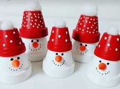 snowmen with red hats and white dots on them