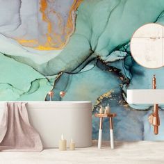 a bath tub sitting under a bathroom mirror next to a white sink and two candles