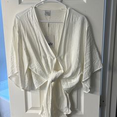 Cute Cropped Tie Up Shirt, Never Worn, Tags Attached! Elegant V-neck Beach Shirt, Summer V-neck Tops For Daytime, Chic V-neck Shirt For Vacation, Elegant Short Sleeve Beach Top, Chic Summer Shirt For Brunch, Chic Summer Brunch Shirt, White Wrap Tops For Summer, White Wrap Top For Summer, Spring V-neck Shirt For Brunch