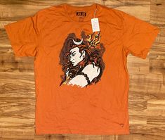 an orange shirt with a woman's face on it