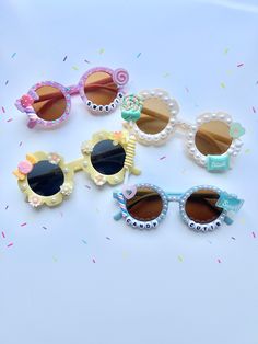 Whimsy Rays presents our "Lollipop Lovelight" collection featuring our ever adorable pearl laced sunnies. Adorn in beautiful gems & pearls with charm accents, your little girl is set to be the tiniest trendsetter in these super cute shades! Listing is for one item. Please choose your selection in the drop down menu. Shades are best fit for 2-8 years old. This item is ready-to-ship and non-customizable. All sales are final. *NOTE: potential choking hazard, products are not intended for children u White Cute Sunglasses For Birthday, Cute White Sunglasses For Gift, Cute White Sunglasses As Gift, Cute White Sunglasses As A Gift, Playful White Sunglasses For Gift, Playful White Sunglasses As Gift, Playful White Sunglasses For Gifts, Playful Party Sunglasses With Polarized Lenses, Cute Summer Sunglasses With Glass Material