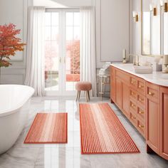 a bathroom with two rugs on the floor and a bathtub in the middle