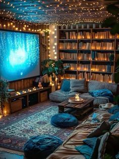 a living room filled with lots of furniture and lights on the ceiling, along with bookshelves