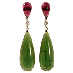 Tourmaline and diamond dangle earrings. Two beautiful elongated pear shaped cabochon green tourmalines totaling 63.41 carats mounted in 18k yellow gold settings with 2 pear shaped pink cabochon tourmalines totaling 13.23cts. Two round cut diamonds separate the pink and green tourmalines. These unique earrings were designed and crafted in the Peter Suchy Workshop. 2 pear shaped green Tourmaline, approx. total weight 63.41cts, SI 2 pear shaped pink Tourmaline, approx. total weight 13.23cts, SI 2 r Long Diamond Earrings, Pink Diamond Earrings, Yellow Gold Diamond Earrings, Long Gold Earrings, Tourmaline Earrings, 18k Gold Earrings, Gold Dangle Earrings, Tourmaline Jewelry, Diamond Dangle Earrings