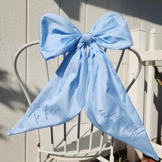 Enhance your bridal or baby shower with this elegant giant blue bow, perfect for a blue theme party. This beautiful chair bow is an ideal decor piece for bridal showers or boy baby shower celebrations. 🎀 HOW TO ORDER 🎀 1. Select your desired color 2. Select Yes or No for added personalization on the tail. 3. Enter your word and font in the personalization box or N/A for no personalization. 4. Check out. 🎀 ABOUT PERSONALIZATION 🎀  You can add a name, or a number to celebrate a birthday such a Blue Bow With Bow Tie Back For Wedding, Blue Party Bow With Ribbon, Blue Ribbon Bow For Party, Blue Theme Party, Babyshower Decor, Bridal Decor, Chair Bows, Bridal Decorations, Blue Theme