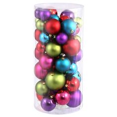 a tube filled with lots of colorful ornaments