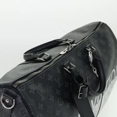 Brand: Louis Vuitton Model: Keepall Bandouliere 50 Color: Black Material: Canvas Inclusions: Dust Bag / Padlock / Key×2 / Name Tag / Powanie / Shoulder Strap Dimensions: W50cm x H29cm x D22cm Serial number: DR0158 Country of origin: France Condition: AB - good condition. The Louis Vuitton Keepall Bandoulière 50 in Monogram Eclipse Canvas is a statement Boston-style bag that combines a sense of luxury with modern sophistication. Crafted from the exclusive Monogram Eclipse Canvas in a sleek black Boston Style, Boston Fashion, Canvas Travel Bag, Grey Color Scheme, Louis Vuitton Keepall, Prada Crossbody Bag, Boston Bag, Name Tag, Black Canvas