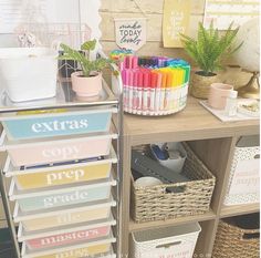 an organized craft room with lots of storage and supplies on the shelf next to each other