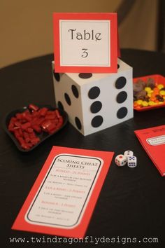 a table with dices and cards on it