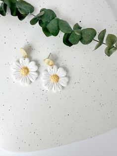 These white daisy earrings add the perfect floral statement to your spring outfits! Floral details are sculpted individually by hand in small batches. Shop the rest of the floral collection here: https://www.etsy.com/shop/PaintedLeafStudioCo?section_id=47823729 Earrings measure approximately 1.75 inches in length and 1.25 inches in width and are lightweight. Hand sculpted polymer clay earrings, crafted delicately and finished with attention to detail. Hypoallergenic nickel-free posts, hoops, hoo Floral Clay Earrings, Outfits Floral, Floral Collection, Daisy Earrings, White Daisy, Earrings White, Spring Flower, Earrings Statement, Floral Earrings