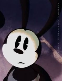 an animated mickey mouse is staring at the camera while wearing a black and white shirt