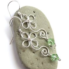 "Whimsical yet elegant earrings are handcrafted from sterling silver filled wire* and your CHOICE of genuine Swarovski crystals, as shown in last photo. These adorable earrings are inspired by the Celtic / Irish shamrock, four leaf-clover, and a multitude of dainty flowers. They would be perfect for spring, St. Patrick's Day, or any time you want to add some charming whimsy to your outfit! Earrings dangle approximately 1.6 inches (4,1 cm) long. Ships gift wrapped as shown in second to last photo Silver Crystal Earrings For May Birthstone Gift, Silver Wire Wrapped Crystal Earrings As Gift, Silver Wire Wrapped Crystal Earrings For Gift, Gift Silver Wire Wrapped Crystal Earrings, Sterling Silver Crystal Earrings With Ear Wire As Gift, Sterling Silver Nickel-free Crystal Earrings As Gift, Nickel-free Sterling Silver Crystal Earrings As Gift, Shamrock Flower, Flower Earrings Silver