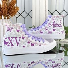 🌸 Step into your Sweet Sixteen or Quinceañera party with an air of elegance and panache, courtesy of our exquisite Flowers Style Custom Converse Shoes. These aren't your run-of-the-mill sneakers; they've undergone a regal transformation exclusively for your special birthday celebration. 🌸 Who says sneakers can't be both sophisticated and comfortable? Well, we're tossing that rulebook out the window! Our Converse shoes are tailor-made for dancing the night away without any foot-related concerns Quinceanera Tennis Shoes, Quince Shoes Sneakers Purple, Quinceanera Shoes Converse, Quince Converse, Quinceanera Shoes Sneakers, Quinceanera Converse, Quinceanera Sneakers, 15 Ideas Quinceanera, Quince Shoes Sneakers