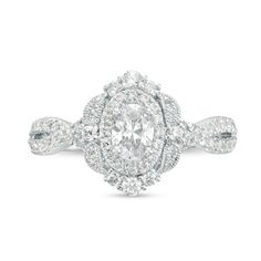 an oval shaped diamond ring with two rows of diamonds around it