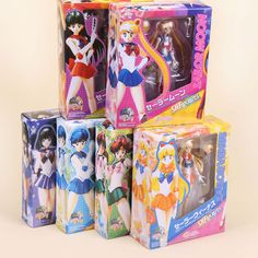 four boxes with sailor moon dolls in them