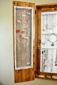 an open wooden box with jewelry in it and a green arrow sticking out of the inside