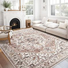 a living room filled with furniture and a large rug on top of a hard wood floor