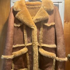 Worn Only Once, Excellent Almost Brand New Condition, Extremely Warm. Brown Shearling Fur Coat, Brown Shearling Fur Coat With Long Sleeves, Brown Sheepskin Long Sleeve Outerwear, Brown Sheepskin Outerwear With Pockets, Brown Sheepskin Long Coat, Brown Shearling Long Coat, Brown Shearling Fur Coat With Pockets, Brown Luxury Long-sleeve Fur Coat, Brown Sheepskin Fur Coat With Pockets