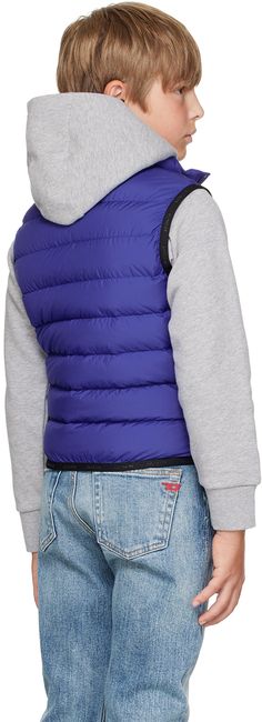 DIST-certified down-filled quilted polyester taffeta vest. · Stand collar · Zip closure · Felted logo patch at chest · Welt pockets · Logo-bonded elasticized trim at hem and armscyes · Full laqué lining · Hand-wash Supplier color: Blue Model measures 54 / 137 cm tall and wears size 8. Moncler Enfant Size: child's height 8: 51.2 / 130 cm 10: 55.2 / 140 cm 12: 59.8 / 152 cm 14: 64.6 / 164 cm Fill: 90% goose down, 10% goose feathers. Fitted Quilted Nylon Vest, Functional Blue Nylon Puffer Jacket, Blue Nylon Sporty Puffer Jacket, Sporty Blue Nylon Puffer Jacket, Blue Nylon Puffer Jacket With Padded Collar, Goose Feathers, Down Vest, Welt Pockets, Welt Pocket