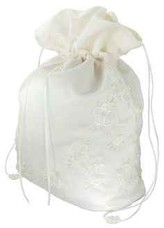 a white drawsack bag with flowers on the front and side, in satin material