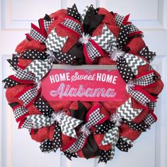 a red and black wreath that says home sweet home