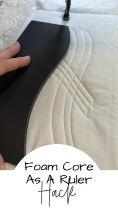 a person's hand on the edge of a mattress with text overlay that reads foam core as a ruler hack