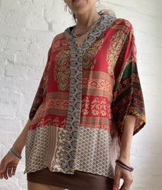 this is colorful free size shirt made of vintage silk material  It is one of a kind, patchwork design with floral prints  inspired by boho hippy style  perfect over all for men and ladies  one size, loose, oversized style, with wide kimono sleeves  more available at  https://www.etsy.com/shop/AltheaStores? Thank you for looking Bohemian Patchwork Kaftan With Kimono Sleeves, Bohemian Kaftan With Patchwork And Kimono Sleeves, Oversized Bohemian Patchwork Tops, Bohemian Patchwork Blouse For The Beach, Oversized Multicolor Bohemian Blouse, Hippie Style Multicolor V-neck Kimono, Bohemian Short Sleeve Patchwork Blouse, Oversized Multicolor Bohemian Tops, Oversized Bohemian Short Sleeve Blouse