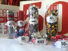 the table is set up with candy and candies for an anniversary party or special occasion