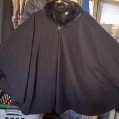 Black Poncho With Fur On The Sleeves And Neck, New Without Tags, Designed In A Large Or Extra Large Size, I Wear A Size 2 Extra Large, And It Fits Me Very Well, So It Is Very Roomy, Material? Flannel Fluffed Up Black Poncho With Batwing Sleeve, Black Batwing Sleeve Poncho One Size, Black Poncho With Batwing Sleeve One Size, Black One-size Cape Outerwear, Oversized Black Poncho For Cold Weather, One Size Black Cape For Winter, Black Poncho Cape For Cold Weather, Black Cape For Cold Weather In Fall, Oversized Black Winter Cape