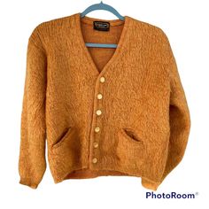 "Large Rare GOLD Orange Vintage 60s DRUMMOND \"Shaggy Man\" MOHAIR Cardigan SWEATER. Rare vintage 60's \"Shaggy Man\"  mohair cardigan by Drummond. It is in great condition. No rips, no mothing, no soiling, no smell. One small hole on the left sleeve. The fuzzy hairs of the sweater do a good job at masking the imperfection. Fuzzy hairy texture made with all natural fibers 65% mohair 35% virgin wool. Rib knot cuffs and twin inset pockets. Beautiful \"abalone look\" buttons. The color of this sweater when photographed shifts tones depending on the light. Please note this before purchasing. Color: Golden Orange with hints of rust red.  Size: Large (Vintage sizes runs smaller than modern sizes. Please note the measurements listed below.) Chest: Approx 20.5\" armpit to armpit Shoulders: Approx Tiny Tim, Mohair Cardigan, Gold Orange, Embroidery And Stitching, Orange Gold, Vintage 60s, Jumpers And Cardigans, Costume Design, Natural Fibers