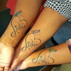 two girls with matching tattoos on their arms