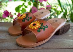 Womens embroidered leather authentic mexican huarache wide slip on sunflower sandal Comfortable Slip-on Huarache Sandals For Summer, Summer Embroidered Leather Huarache Sandals, Embroidered Leather Huarache Sandals For Summer, Spring Brown Clogs With Stitched Sole, Traditional Open Toe Clogs For Summer, Traditional Slip-on Huaraches For Spring, Casual Embroidered Huarache Sandals For Spring, Casual Summer Clogs With Stitched Sole, Traditional Slip-on Huarache Sandals For Spring