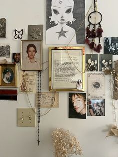 a white wall covered in pictures and other items