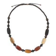 Exotic beads crafted from assorted woods and coconut shell line a black cord in this beaded necklace. From artisan Shutikarn Kantung the long necklace offers a natural appeal with its rugged design. Shell Beaded Necklace, Shell Beads Necklace, Coconut Wood, Fiber Jewelry, Wood Bead Necklace, Long Beaded Necklace, Buy Wood, Creating Jewelry, Coconut Shell