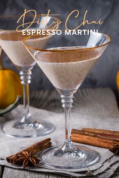 two martini glasses filled with cinnamon and apple cider