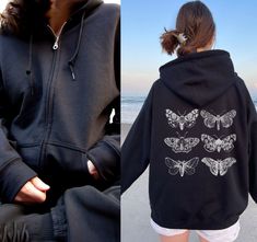 Zip up Hoodie, Zip Up Hoodie Y2K, Y2K Sweatshirt, Y2K Grunge, Dark Academia Hoodie, Women Trendy, Hoodie Y2K, Y2K Aesthetic, Butterfly Hoodie, Y2K Streetwear Hoodie, Witchy Hoodie, Goth Sweatshirt Moth, Zip up Womens  DESCRIPTION ✽ This classic and comfy zip-up hoodie is perfect for everyday and every occasion. Wear it to the gym, class or when you're just hanging out at home. This aesthetic hoodie has a relaxed fit, long sleeves and an oversized hood. Made with a thick blend of cotton and polyester, it feels plush, soft and warm, a perfect choice for any cold day. In the front, the spacious kangaroo pocket adds daily practicality while the hood's drawstring is the same color as the base sweater for extra style points. ✽ Please order 1-2 sizes larger than your normal size if you are lookin Goth Moth, Black Techwear, Grunge Sweatshirt, Aesthetic Butterfly, Hoodie Y2k, Streetwear Shirts, Aesthetic Hoodie, Streetwear Hoodie, Hoodie Women