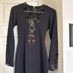 New With Tags. Great Party Dress. Black With Open Lace On Front & Sleeves. Black Stretch Mini Dress With Lace Trim, Black Mini Dress With Lace Trim For Fall, Black Formal Mini Dress With Lace Trim, Formal Black Mini Dress With Lace Trim, Open Back Dress Black, Party Dress Black, Open Back Dress, Open Back Dresses, Dresses Backless