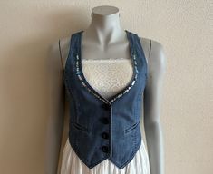 "Women's Vest Sequin Denim Vest Blue Denim Vest Jean Waistcoat Fitted Womens Sleeveless Denim Jacket  Measurements (lying flat): Length(back): 15\"/ 38 cm Pit to pit: 16\"/ 41 cm Waist: 14.5\"/ 37 cm Please check measurements to insure a proper fit. Remember to allow yourself some extra room for movement. You can compare these with something from your closet that fits you well. Please convo me if you need additional measurements. Condition: great Vintage Condition N.B. Color may slightly differ Dark Wash Sleeveless Vest For Spring, Spring Denim Vest Jacket, Fitted Dark Wash Denim Vest For Spring, Stretch Denim Blue Vest For Spring, Spring Stretch Denim Blue Denim Vest, Spring Stretch Denim Vest, Fitted Sleeveless Dark Wash Denim Jacket, Stretch Medium Wash Sleeveless Denim Vest, Spring Stretch Denim Vest In Medium Wash