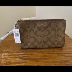 Brand New Large Double Zip Coach Wristlet. Retails For $175 Elegant Handheld Wallet With Zipper Pouch, Coach Pouch Clutch Gift, Coach Clutch Gift Pouch, Coach Pouch Clutch As Gift, Elegant Zipper Pouch Wristlet Clutch, Elegant Wallets With Wrist Strap As Gift, Elegant Wristlet Clutch With Zipper Pouch, Elegant Brown Wristlet For Evening, Elegant Brown Evening Wristlet