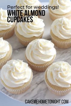 cupcakes with white frosting sitting on top of a marble slab that says, perfect for wedding white almond cupcakes