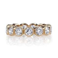 Approximately 3.50-4.50ctw G-H/VS old European cut diamonds bezel set in a handcrafted eternity band. Please inquire for additional customization.